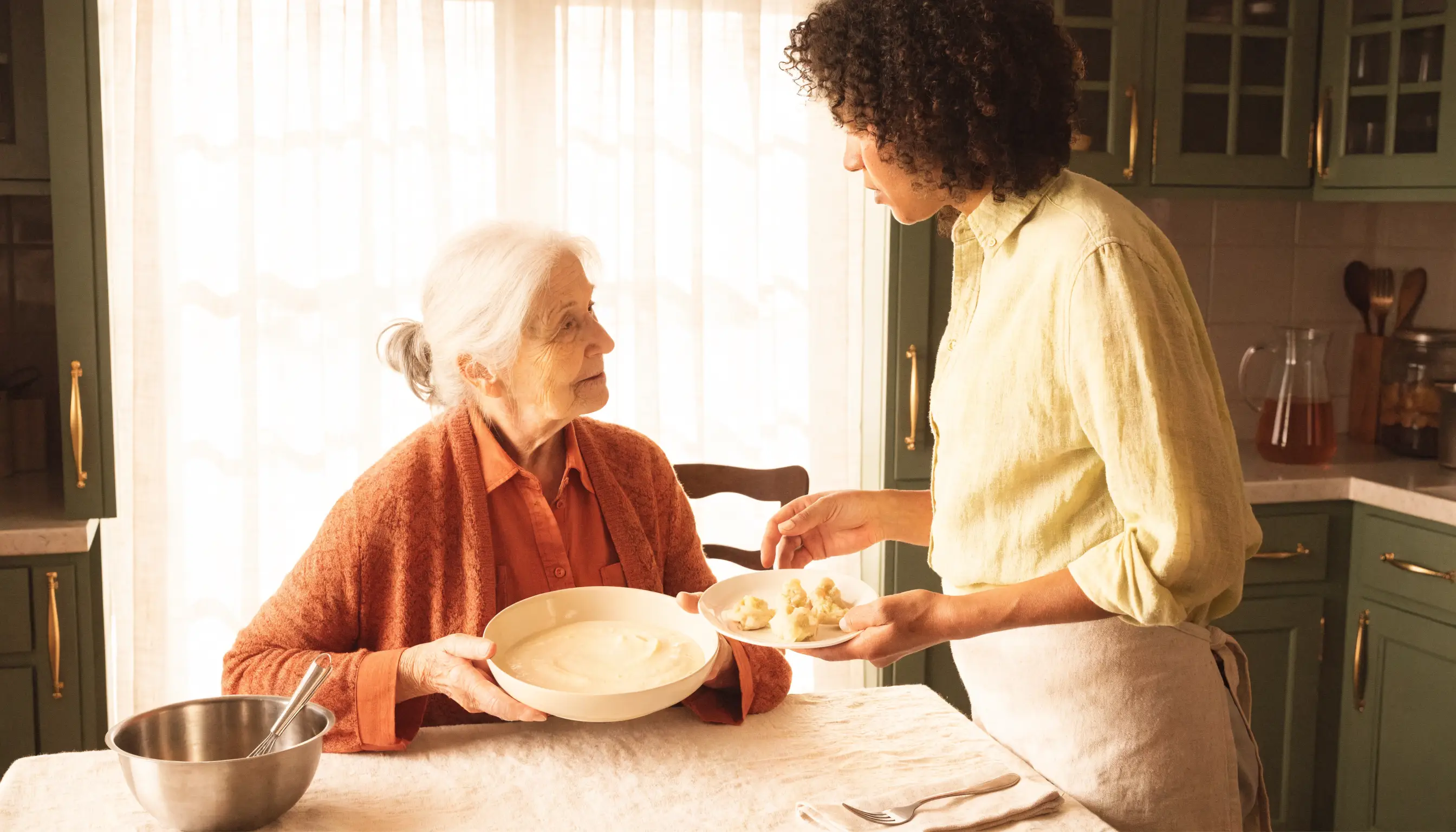 An older adult and caregiver preparing a texture-modified meal together